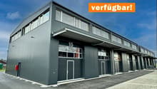 warehouse style building, multiple doors and windows, garage entrance