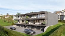 3-story modern apartment building with balconies, large windows, and a parking area in front