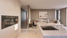 modern kitchen with island, double oven, modern faucet, living room with couch, coffee table, picture frame