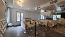 modern bar counter, white leather chairs, tiled floor, white walls, modern lighting