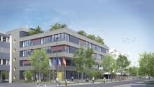 6 story building, red and gray color scheme, 14 windows, green roof, flagpoles, large trees
