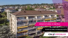 A modern multistory building with balconies and internal parking for motorbikes.