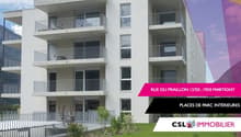 4-story apartment building with balconies, white exterior, large windows, located on Rue du Praillon in Martigny