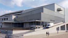 modern building, raised ground floor, sloped entrance, several floors, glass windows, grey concrete