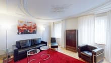 leather couch, glass tables, wooden cabinet, painting, red carpet