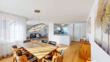 dining table with 6 chairs, round light hanging from ceiling, open kitchen, balcony, large windows