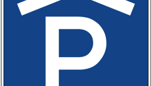 Blue square sign with a house icon above a large white P in the center