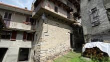 stone building, balconies, tiled roofs, two storeys