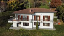 two story house, white, brown roof, windows, balcony, garden