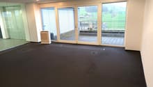 empty room, black floor, white walls, sliding glass doors, balcony, air conditioner, view of a green field
