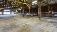 Wooden floor, wooden trusses, windows on the side wall