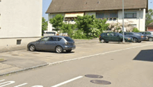 Multiple parking spots with cars parked on both sides of the street.