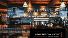 counter, shelves filled with liquor, blackboard menu