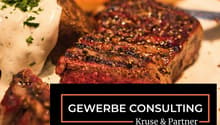 Steak with white sauce and parsley on a plate