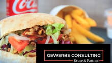 Sandwich with lettuce, tomato, onion, and meat, french fries, Coca-Cola