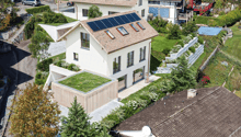 2 story house, tiled roof, solar panels, raised ground floor, terrace, green roof, swimming pool