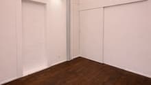 empty room, hardwood floors, pink painted ceiling, recessed lighting, two large doors
