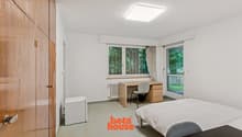 Bedroom with small Fridge