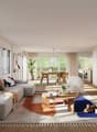Spacious open-plan living room with large windows, grey sofa, wooden dining table, fireplace, and various decorative elements such as plants and artwork