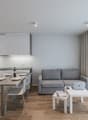 modern kitchen with dining area and living room with sofa and dining table