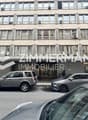 photo immeuble muzy logo