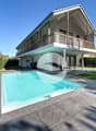 Extérieurs : Vue villa côté jardin