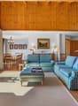 / a living room with a couch and chairs in it