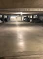 underground parking lot with several cars parked