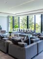 U-shaped sofa with coffee table, TV, floor to ceiling windows