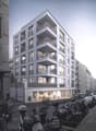 multistory building, balconies on each floor, white exterior, modern design, ground floor entrance