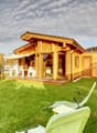 wooden house, terrace, garden, lawn, outdoor dining table and chairs