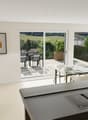 modern kitchen with dining area, large windows, balcony, modern furniture, plants