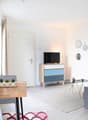 Minimalist design, wooden table, sofa, TV on cabinet, framed art, rug