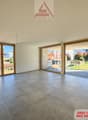 large room, gray tile floor, sliding glass doors leading to a balcony