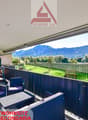 chairs, table, railings, outdoor storage boxes, mountains view