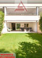 Apartment, modern architecture, garden, balcony with furniture