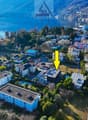 cluster of houses, swimming pool, green surroundings, lakeside view