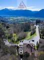 Mountains, valley, road, houses, trees, cars parked