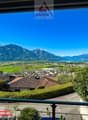 Mountains, valley, houses, greenery, road, water