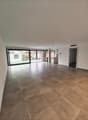 spacious open room, tile flooring, large windows, balcony