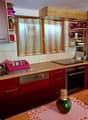 kitchen, sink, oven, dishwasher, red cabinets, countertop, small windows, open shelves