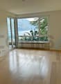 soggiorno-pranzo vista lago / Wohn- und Essbereich mit Seeblick / Living/Dining Room with Lake View