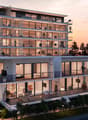 modern architecture, white exterior, glass walls, balconies, open terrace