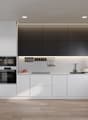 modern kitchen with white cabinets, black accents, modern appliances, wooden floors, minimalist design