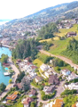 Mountain slope, houses, road, river, lake, trees, bridge, cars, swimming pool