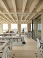 open space office, white desks, chairs, bookshelves, wide windows