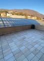 tiled floor, glass canopy, view of the city