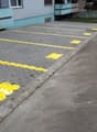 paved parking area with yellow markings