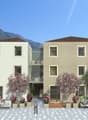 3-story apartment building with beige exterior, large windows, balconies, and landscaping with trees and flowers in the foreground