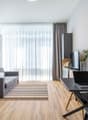 Sofa, table, TV, plant, desk, laptop, chair, artwork